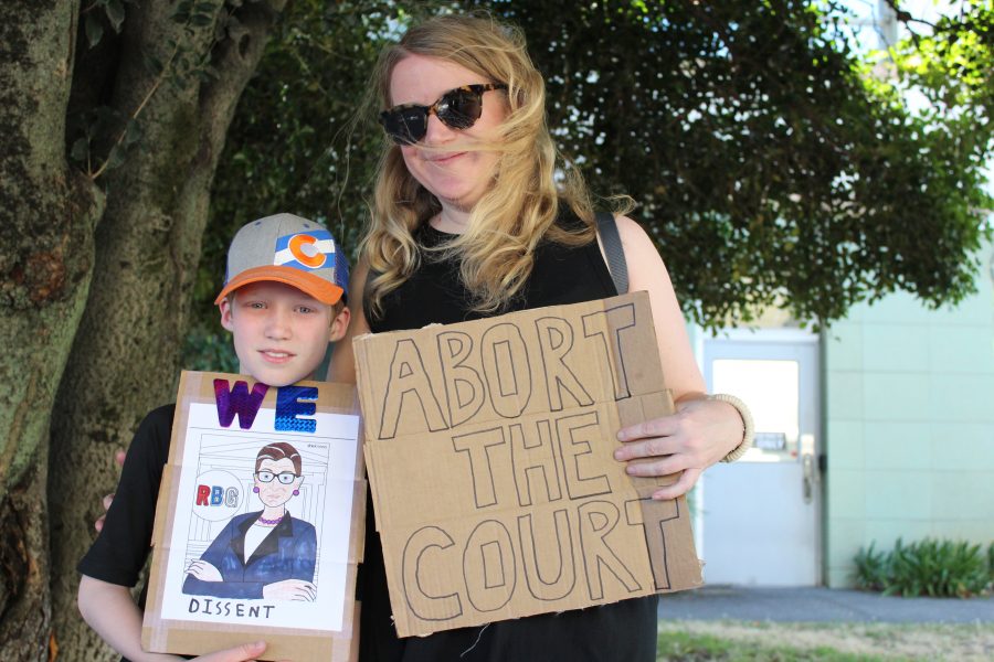 Young boy and his mother at pro-choice protest