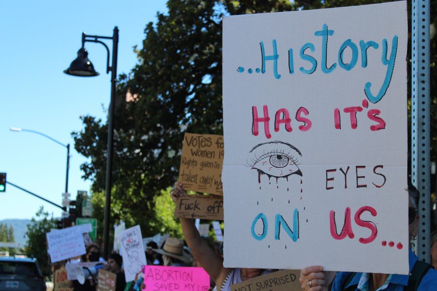 'History has its eyes on us' sign
