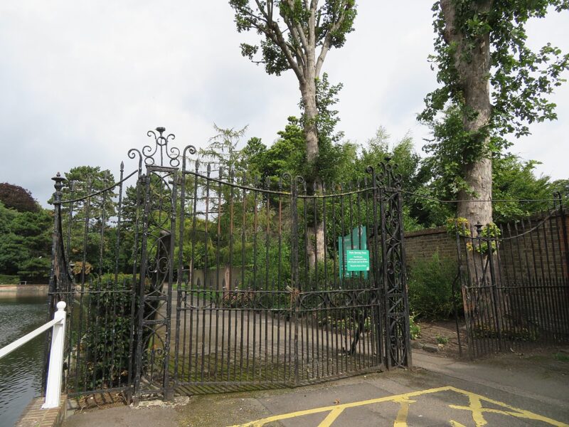 Image of park with metal fencing in foreground